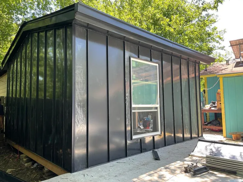 Black standing seam metal wall panels for Metal Roof Installation in Chanhassen