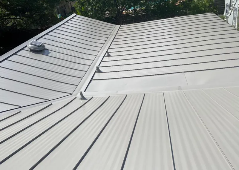 Solar attic fan installed on a metal roof for Roof Ventilation in Chanhassen